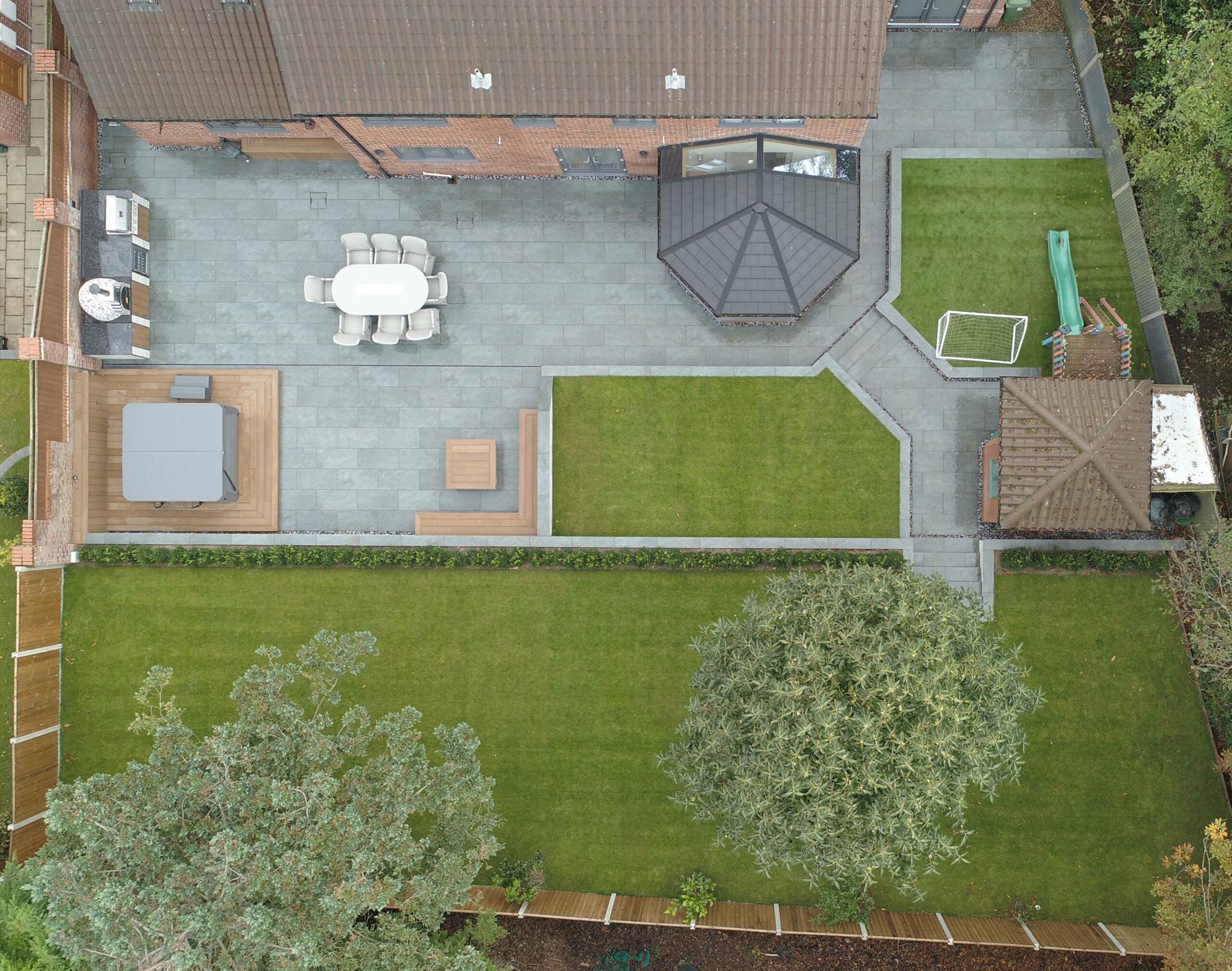 Aerial view of a finished garden with patio, lawns and a gazebo
