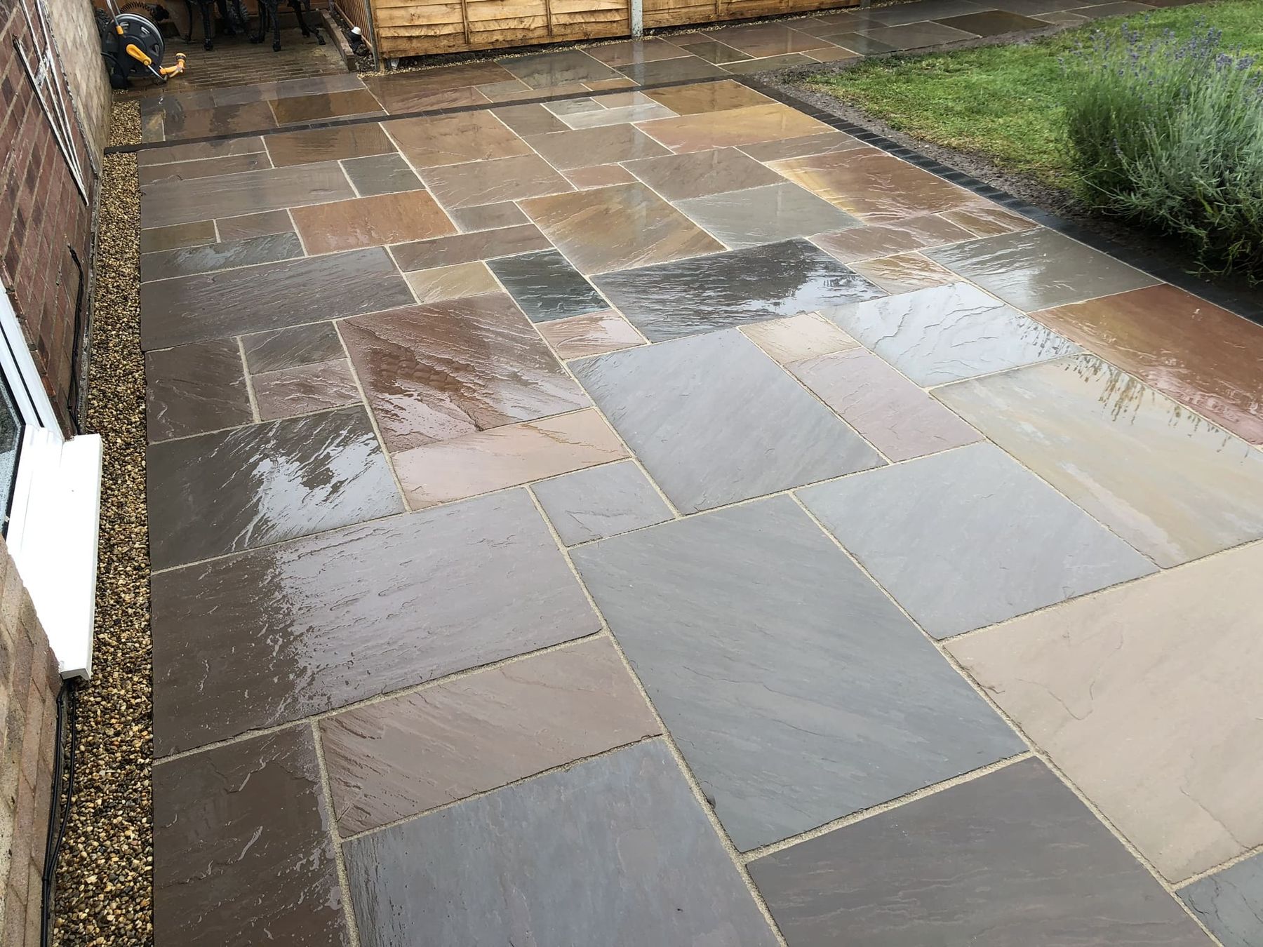 Close view of a natural stone patio after rain