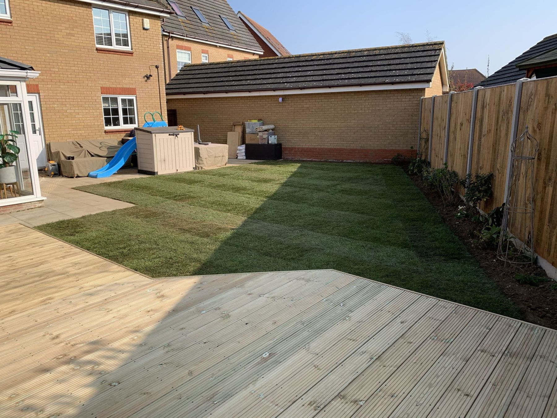 Timber decking with a new lawn and fencing