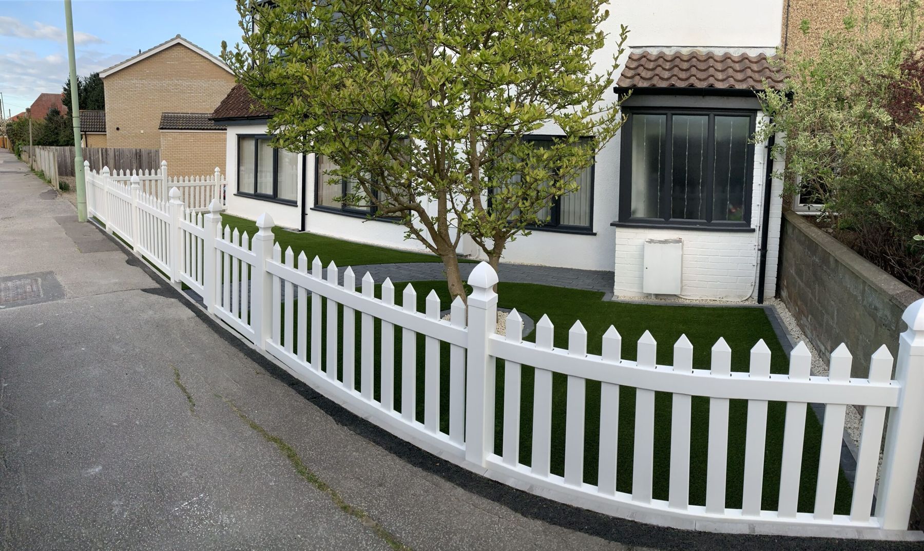 White picket fence around a front garden
